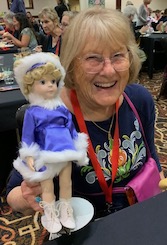 Judith_holding_Sonja_Henie_ice_skater_doll_at_convention_2023.jpg